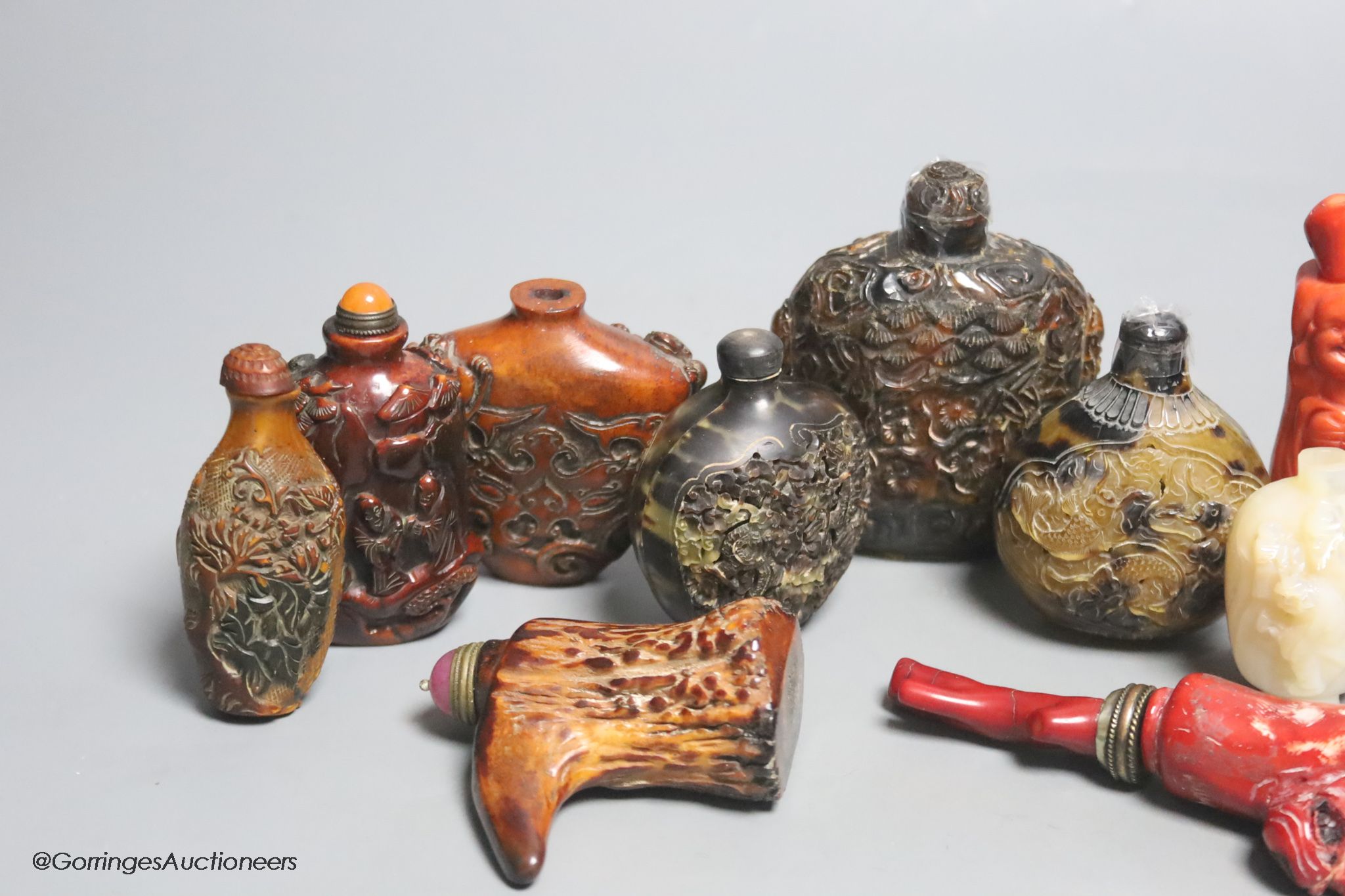 A collection of Chinese eleven horn and mother of pearl snuff bottles